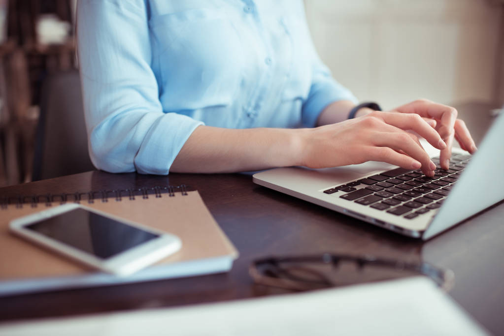 Office manager handling billing tasks at a workstation