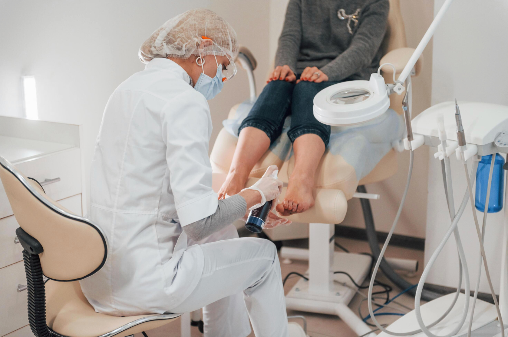 Podiatrist examining a patient's foot