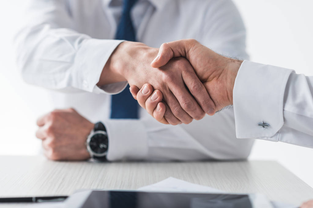 Handshake between practice owner and partner